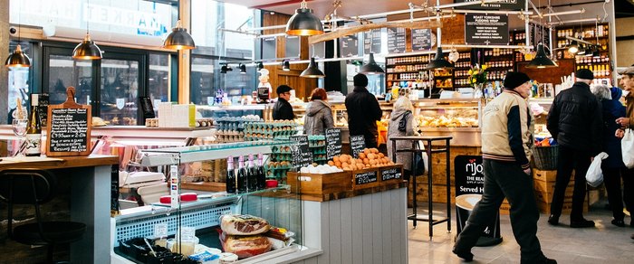Counters and shoppers inside the covered market hall in Preston
